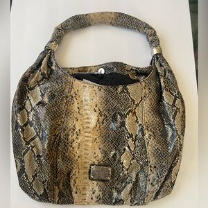 This snake skin purse is nice and light weight.